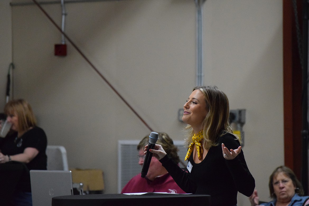 Columbia Basin Cancer Foundation Program Coordinator Amanda Carpenter jokes with the crowd while making announcements during the Country Sweethearts festivities on Feb. 4 at the Grant County Fairgrounds.