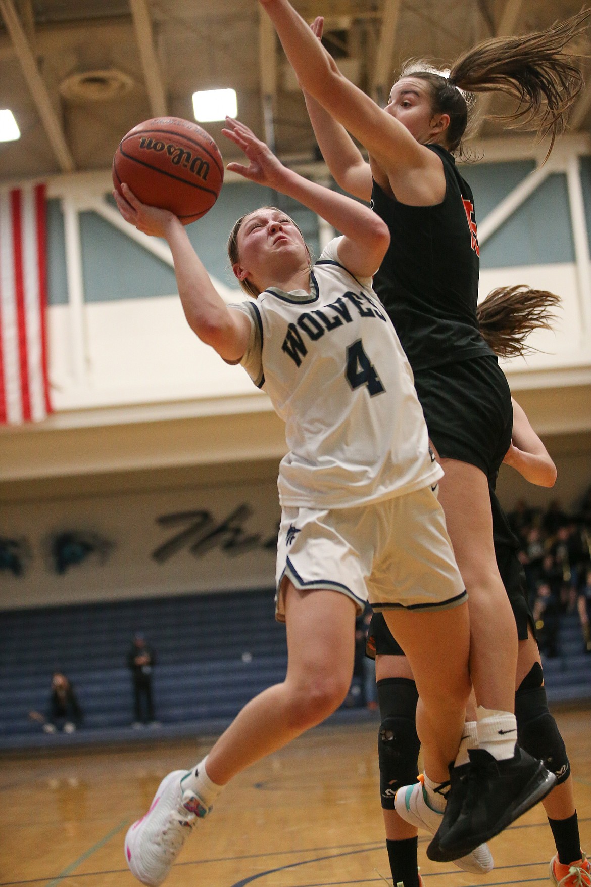 JASON DUCHOW PHOTOGRAPHY
Sophia Zufelt (4) of Lake City goes up for a shot against Capri Sims of Post Falls in the 5A Region 1 girls basketball second-place game Thursday night at Lake City.