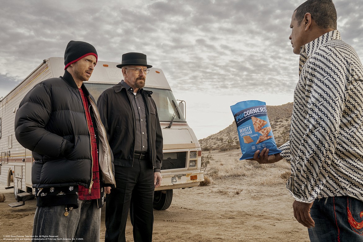 This photo provided by Frito-Lay shows Aaron Paul, Bryan Cranston and Raymond Cruz in scene from PopCorners 2023 Super Bowl NFL football spot. Big name advertisers are paying as much as $7 million for a 30-second spot during the big game on Sunday, Feb. 12, 2023. In order to get as much as a return on investment for those million, most advertisers release their ads in the days ahead of the big game to get the most publicity for their spots. (Frito-Lay via AP)