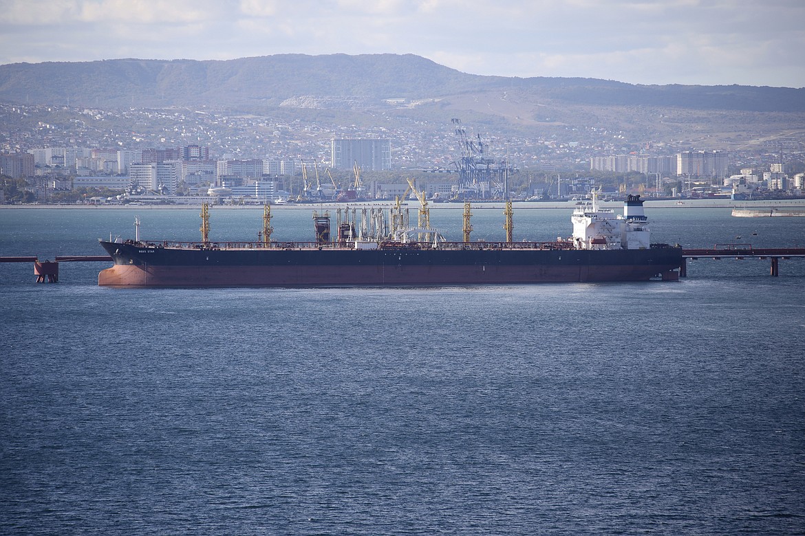 FILE - An oil tanker is moored at the Sheskharis complex, part of Chernomortransneft JSC, a subsidiary of Transneft PJSC, in Novorossiysk, Russia, on Oct. 11, 2022. A Russian official says the country will will cut oil production by 500,000 barrels per day next month in response to the West capping the price of its crude over the war in Ukraine. According to multiple Russian news media reports, Deputy Prime Minister Alexander Novak said Friday, Feb. 10, 2023 that “we will not sell oil to those who directly or indirectly adhere to the ’price ceiling.'" (AP Photo, File)