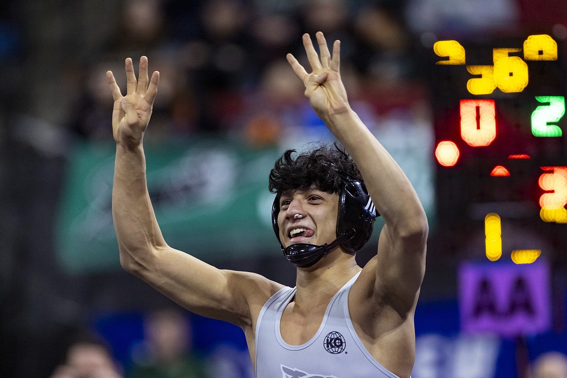 Glacier's Teegan Vasquez raises his arms after defeating Butte's Kip Pumnea in the Class AA 132 pound final during the second day of the All-Class State Tournament at First Interstate Arena in Billings on Saturday, Feb. 11. (Mike Clark/406mtsports.com)