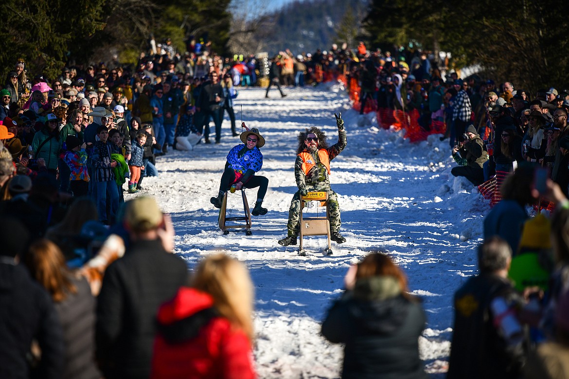 Participants race down Sugar Hill during the Barstool Ski Races at Cabin Fever Days in Martin City on Saturday, Feb. 11. (Casey Kreider/Daily Inter Lake)