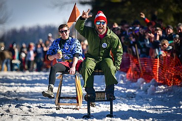Participants race down Sugar Hill during the Barstool Ski Races at Cabin Fever Days in Martin City on Saturday, Feb. 11. (Casey Kreider/Daily Inter Lake)