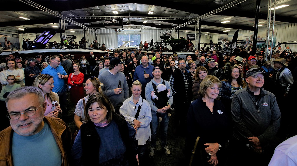 A crowd waits for the drawing of a winner of a new pontoon boat at the Hagadone Marine Center on Saturday.