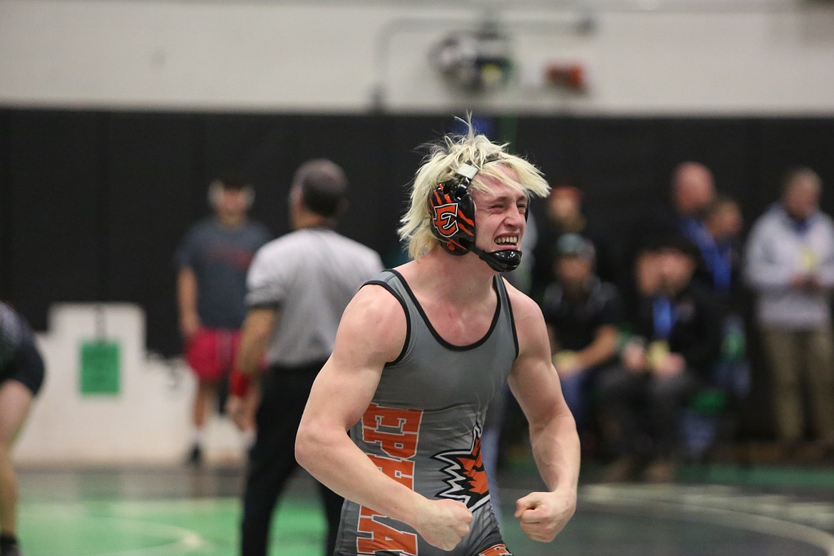 Ephrata senior Hudson Sager flexes in celebration of winning his 160-pound semifinal match over Rogers (Spokane) senior Blaise Cross at the 2A Region 4 tournament in Spokane on Saturday.