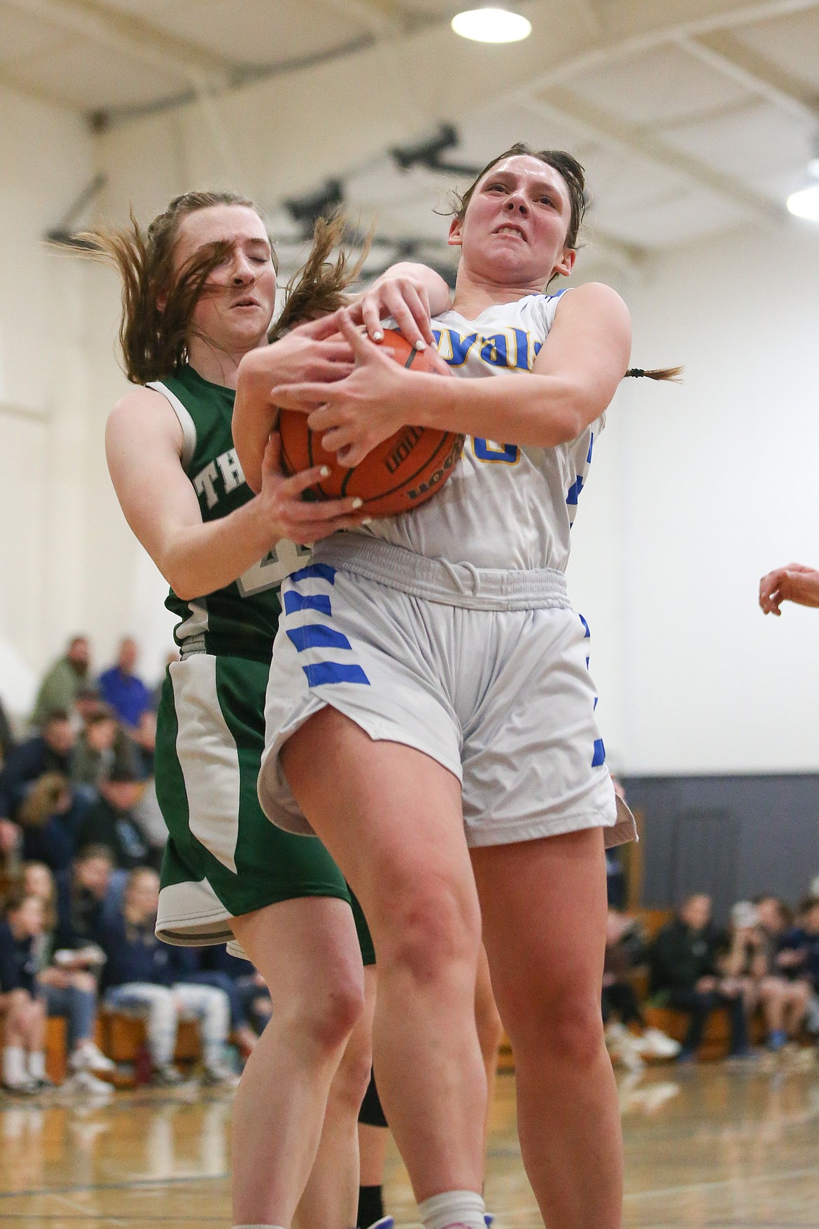 JASON DUCHOW PHOTOGRAPHY
Symone Pilgrim of North Idaho Christian School battles an Oaks player for a rebound in the championship game of the Mountain Christian League tournament Saturday night at The Oaks in Spokane Valley.