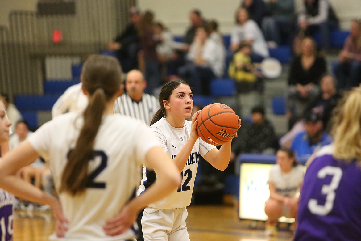 Quincy junior Aidan Bews brings the ball up the floor during the second half of Friday’s game against Omak. Bews finished the game with 14 points.