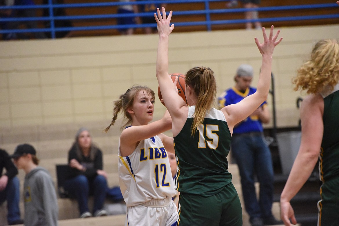 Libby's Rylee Boltz seeks an opening against Whitefish Friday night. (Scott Shindledecker/The Western News)