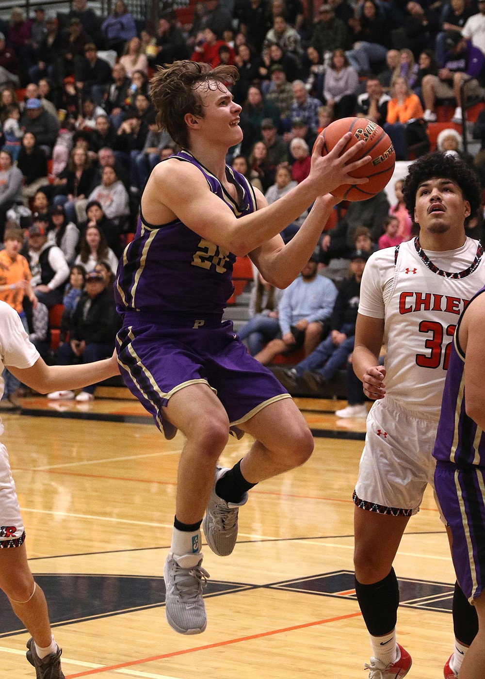 Pirate Jarrett Wilson goes up for two points during Saturday's Polson-Ronan game. (Bob Gunderson photo)