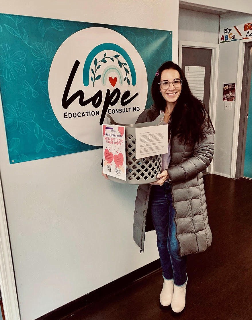 Emily Christopherson of the Community Library Network Alliance drops off a Hygiene Hamper basket at Hope Education Consulting in Hayden. Libraries in the network are collecting toiletries and personal hygiene items through Feb. 25 to help those in need.