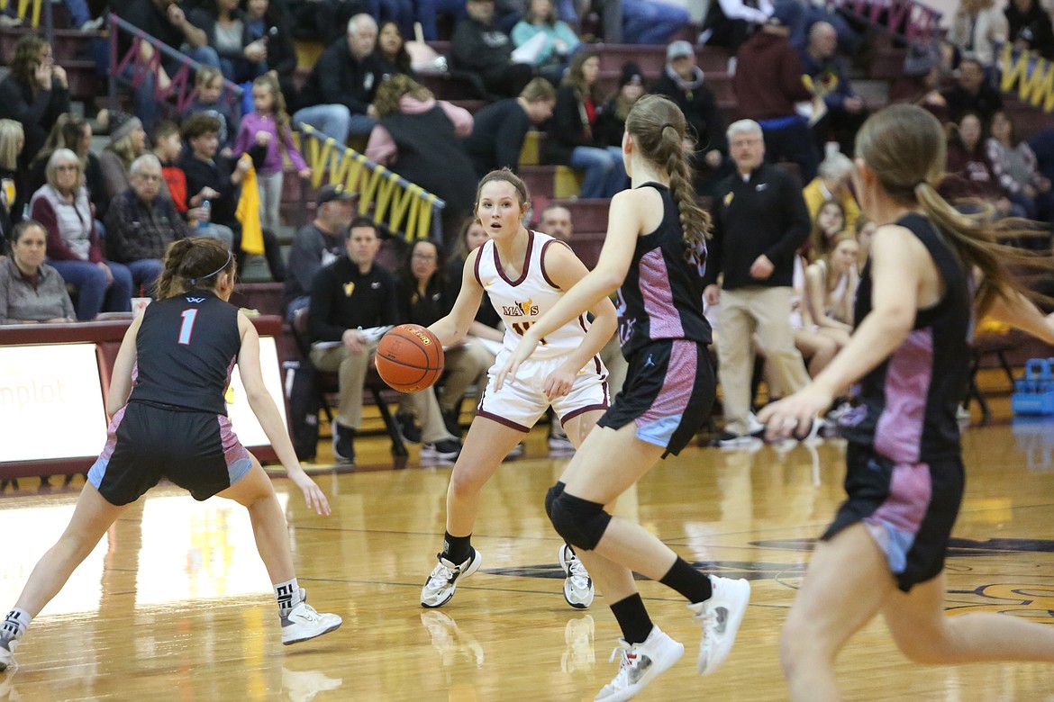 Moses Lake junior Lexi Cox looks for an open teammate against West Valley (Yakima) on Feb. 3.