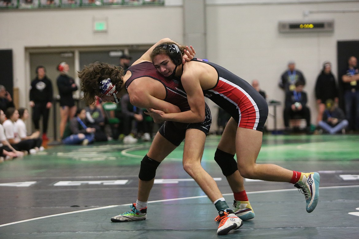 Othello freshman Camilo Mendez III, right, placed third in the 145-pound bracket at the 2A Region 4 tournament at East Valley (Spokane) High School on Saturday