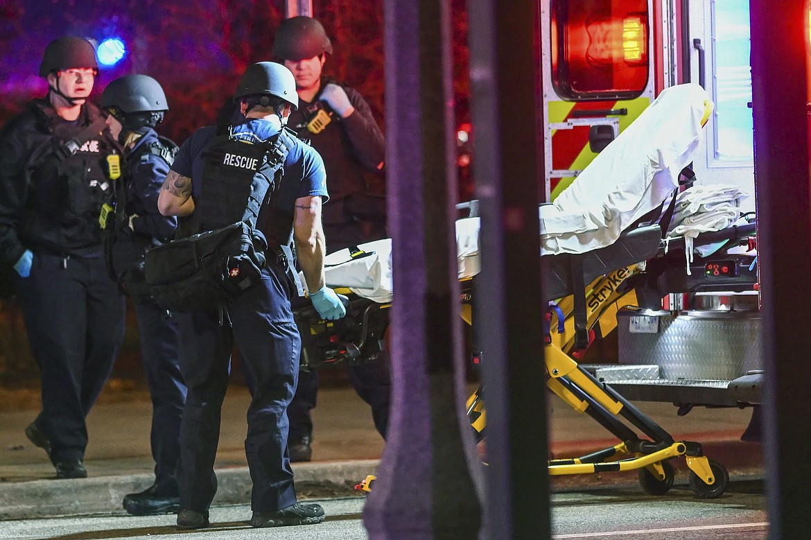 A stretcher is unloaded from an ambulance outside the Michigan State University Union following shootings on campus on Monday, Feb. 13, 2023, in East Lansing, Mich. (Nick King/Lansing State Journal via AP)