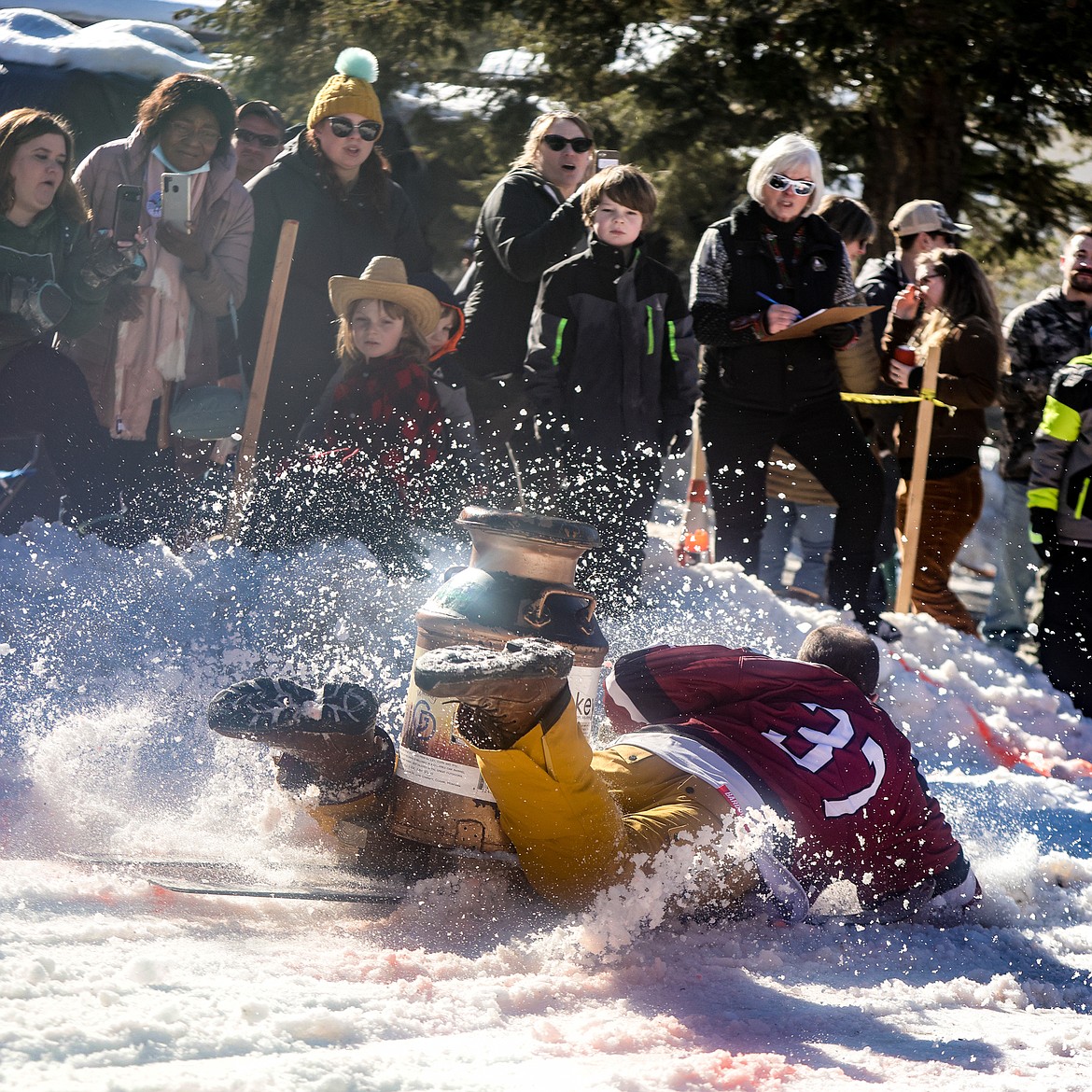 A competitor in the Bar Stool race crashes into the finish line at Cabin Fever Days in Martin City. (JP Edge photo)