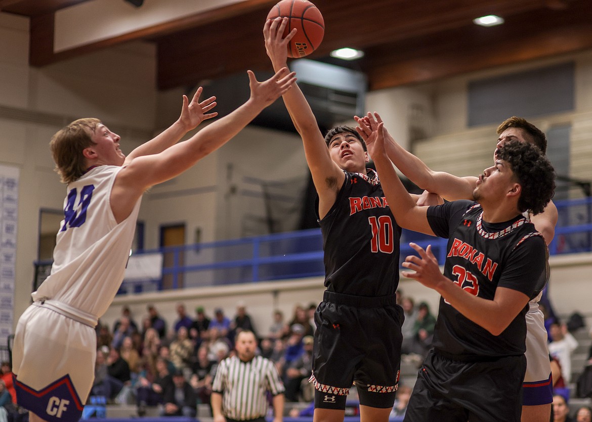 Senior Robbie McCrea Jr. goes up for a ball against a Wildcats opponent in Columbia Falls on Thursday. (JP Edge/Hungry Horse News)