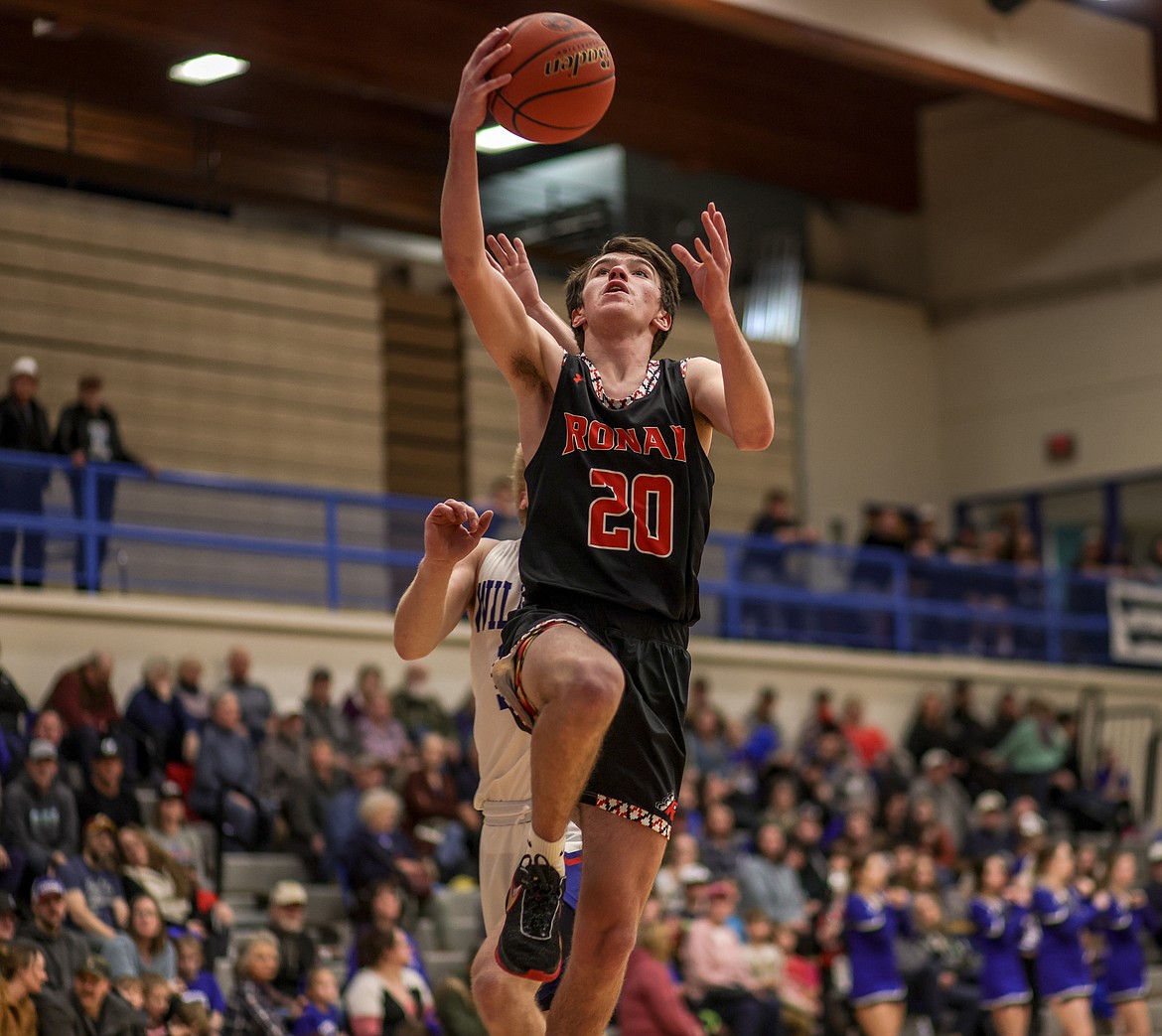 Junior Ted Coffman III goes for the basket in Columbia Falls on Thursday. (JP Edge/Hungry Horse News)