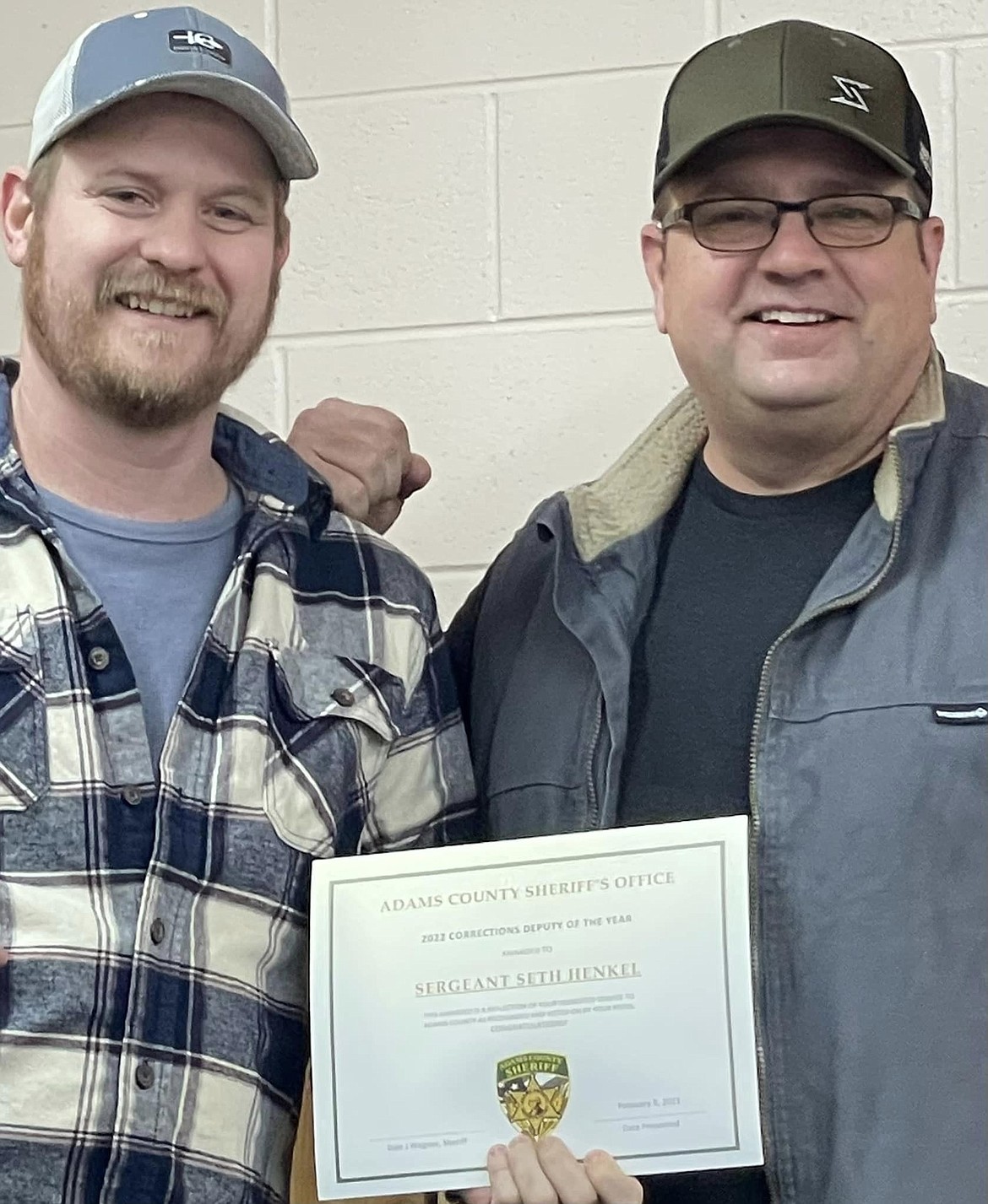 Seth Hinkle, left, received the Adams County Sheriff’s Office corrections deputy of the year award from Sheriff Dale Wagner at the ACSO awards dinner.