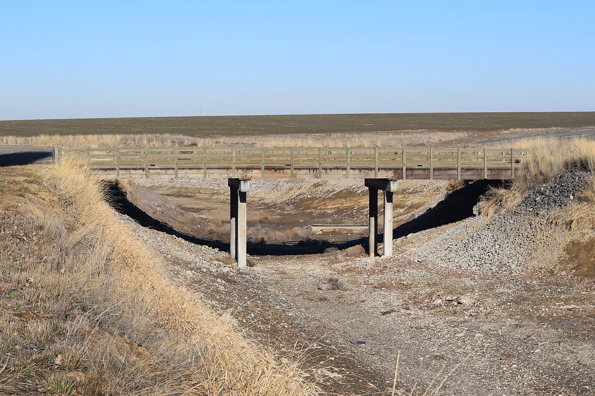 A wooden bridge over the East Low Canal north of Warden. Grant County is planning to remove a portion of this bridge and another south of Warden to allow the East Columbia Basin Irrigation District to finish widening the canal where it flows through the county.