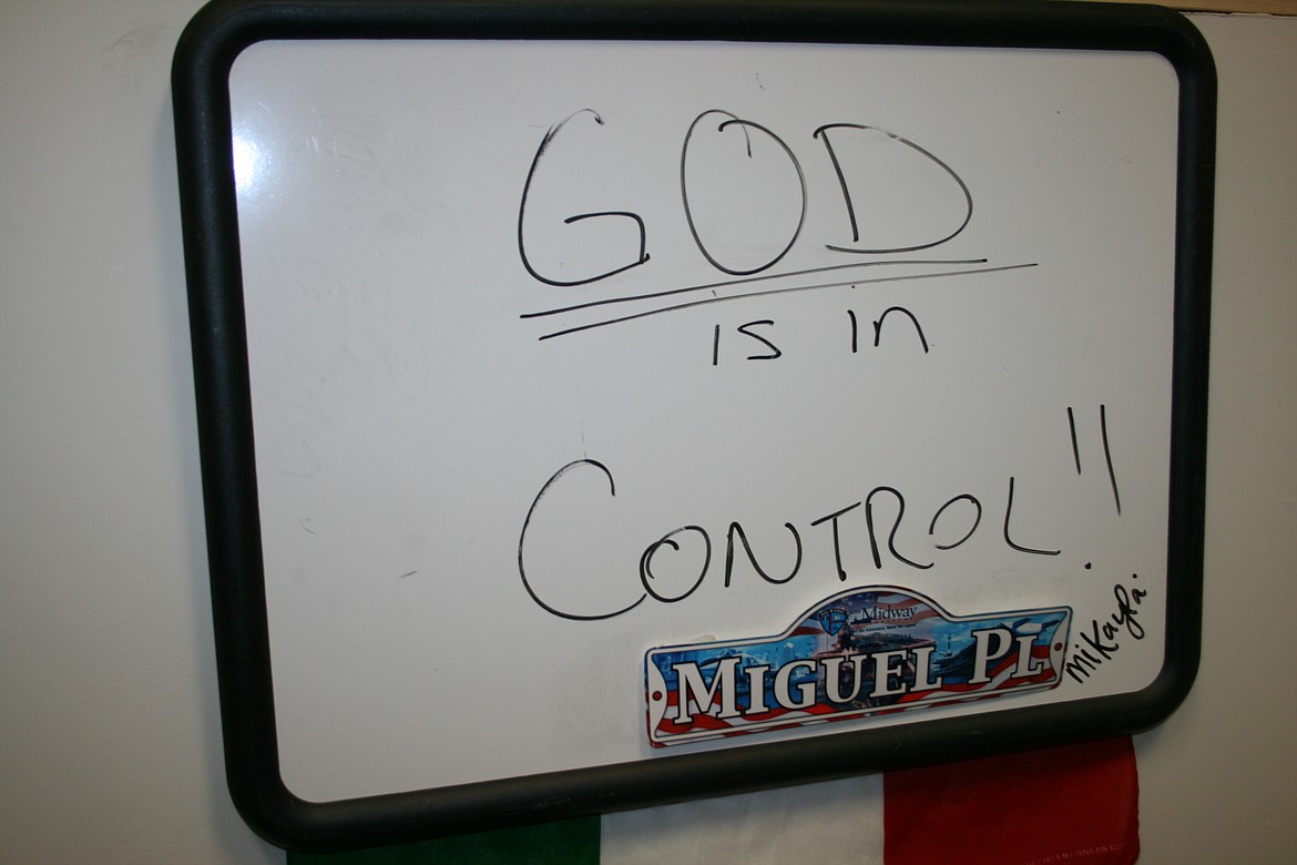 A devout Christian, Adams County Commissioner Mike Garza said he keeps this sign in the office of his Othello business to remind him who’s in the lead.
