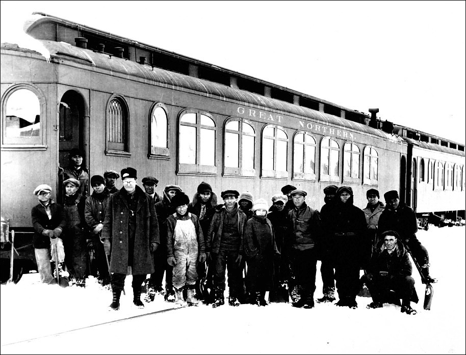 A section crew with Japanese people on Marias Pass. The railroad passenger cars served as a dormitory. (Courtesy photo)