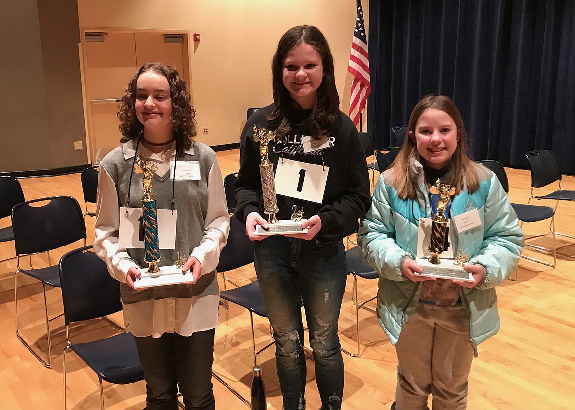 Whitefish Middle School eighth-grader Teagan Chisholm (pictured left) won the 2023 Flathead County Spelling Bee with the word “ricochet.” Columbia Falls Junior High sixth-grader Clara Patton placed second (middle), followed by Hedges Elementary School fifth-grader Lennan O’Connor in third. All three head to the state spelling bee at  1 p.m. March 11 at Montana State University in Bozeman.