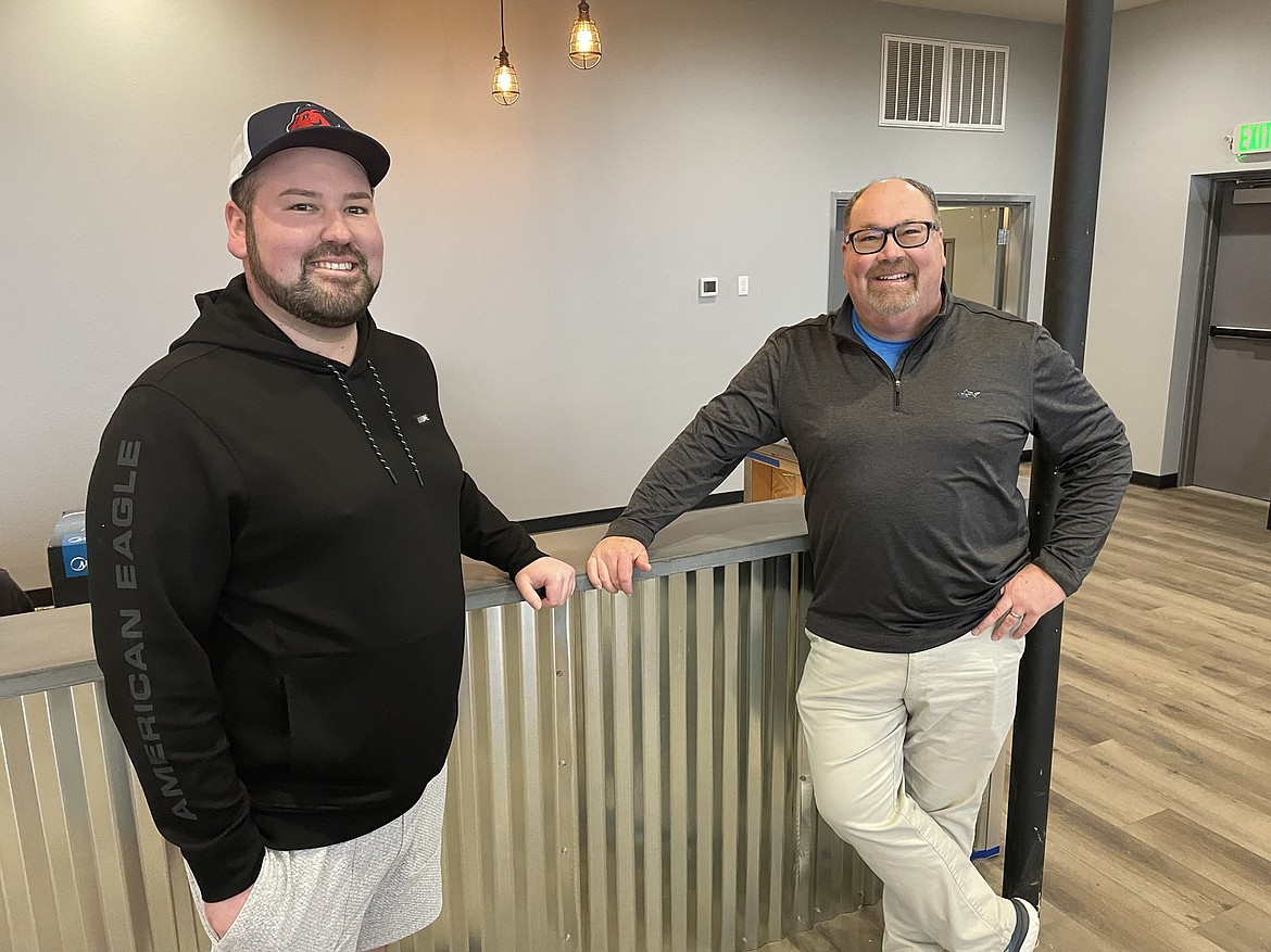 Connor Stakelin and his father William on the newly installed bar of the Moses Lake Taproom, which they hope to have open on March 9. Located in the Vista Village shopping center in the space formerly occupied by Squirrel Fight Artisan Brewing, the Stakelins plan to officer craft beer, wine and cider from across the region.