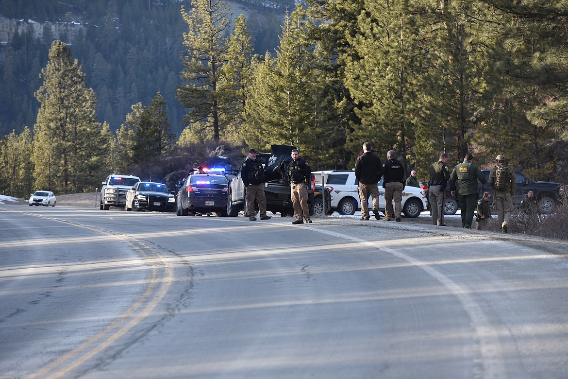 Law officers from several agencies were at the scene where a Montana Highway Patrol trooper was struck by a suspect vehicle during a police chase on Montana Highway 37 near Lake Koocanusa Bridge. (Scott Shindledecker/The Western News)