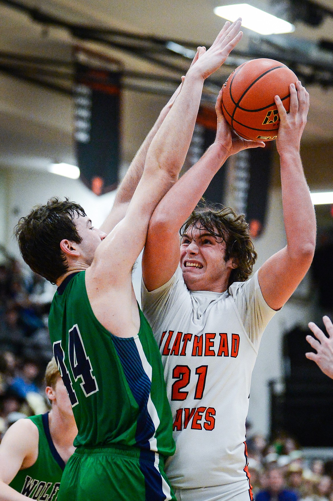 Flathead's Slate Burrington (21) is guarded by Glacier's Noah Dowler (44) in the second half at Flathead High School on Thursday, Feb. 16. (Casey Kreider/Daily Inter Lake)