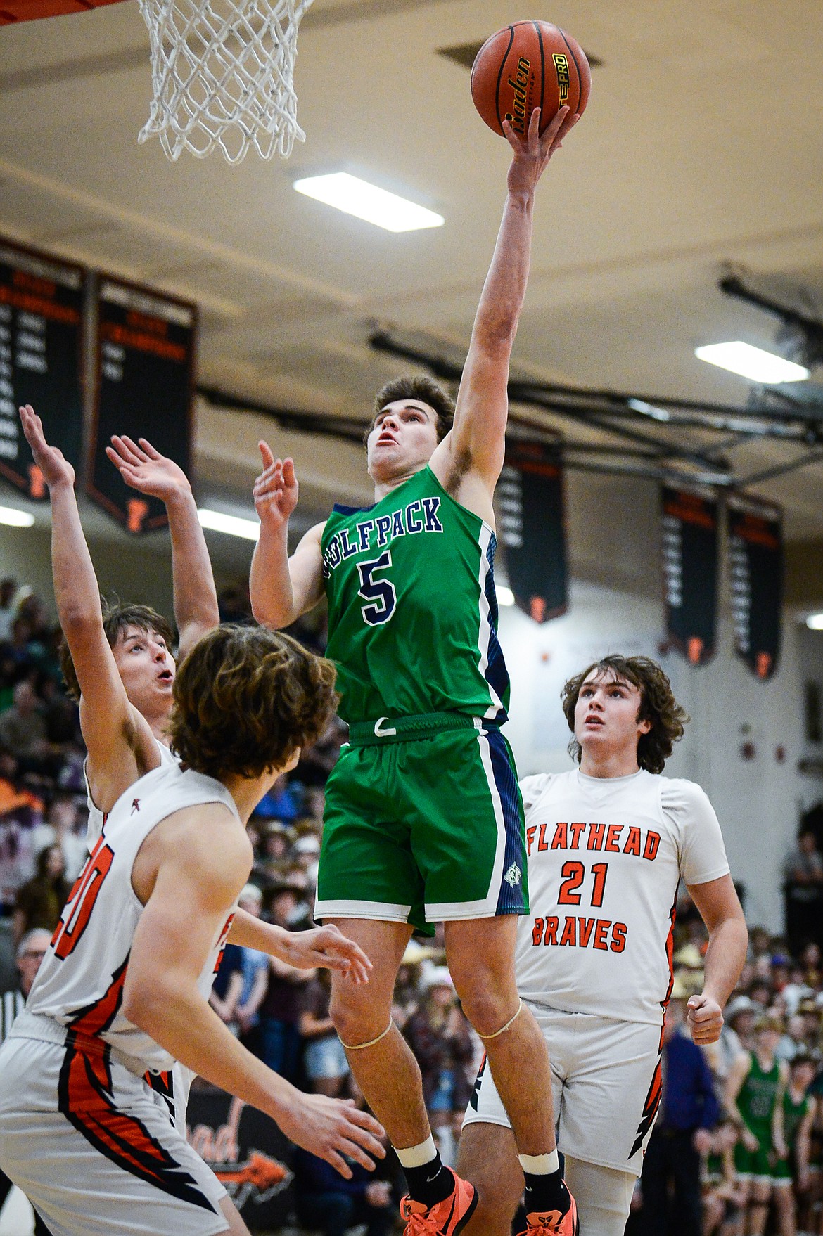 Glacier's Ty Olsen (5) drives to the basket in the first half against Flathead at Flathead High School on Thursday, Feb. 16. (Casey Kreider/Daily Inter Lake)