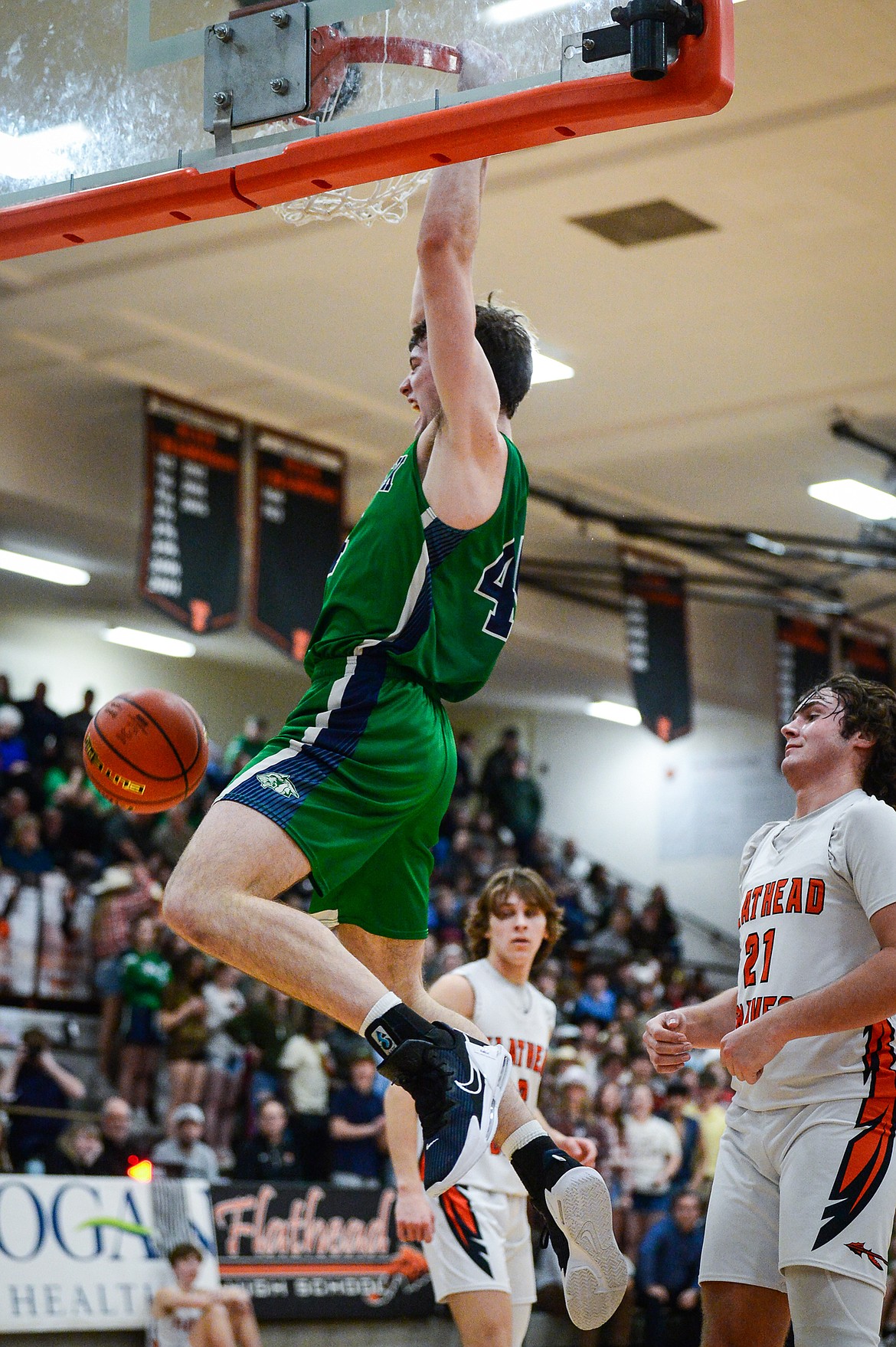 Glacier's Noah Dowler (44) dunks in the first half against Flathead at Flathead High School on Thursday, Feb. 16. (Casey Kreider/Daily Inter Lake)