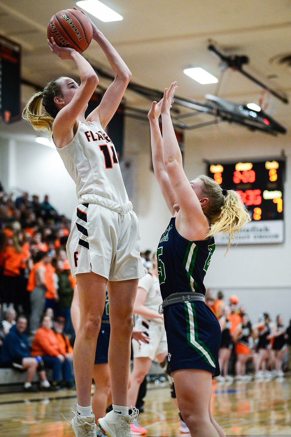 Flathead's Kennedy Moore (14) shoots over Glacier's Charlotte Osler (15) in the first half at Flathead High School on Thursday, Feb. 16. (Casey Kreider/Daily Inter Lake)