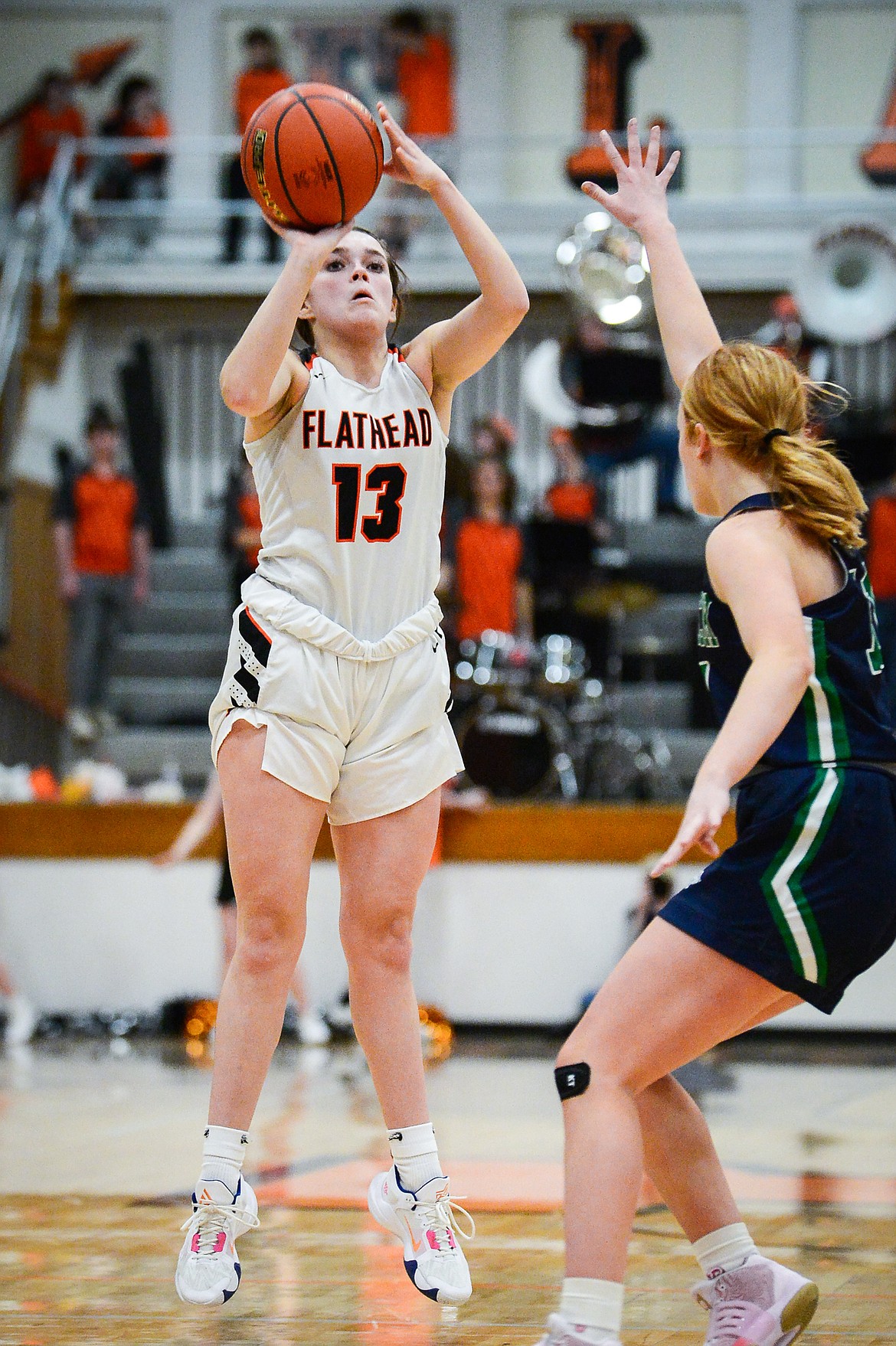 Flathead's Avery Chouinard (13) shoots a three in the first half against Glacier at Flathead High School on Thursday, Feb. 16. (Casey Kreider/Daily Inter Lake)