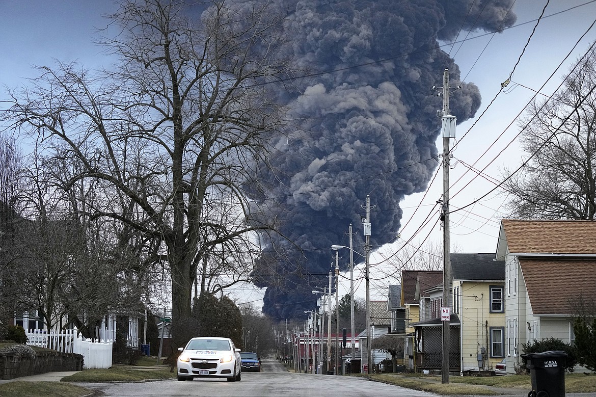 A black plume rises over East Palestine, Ohio, as a result of a controlled detonation of a portion of the derailed Norfolk Southern trains Monday, Feb. 6, 2023. (AP Photo/Gene J. Puskar)