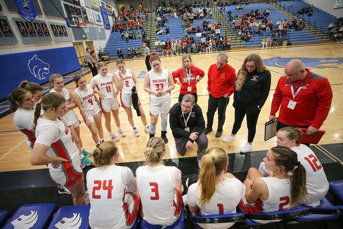 Sandpoint High School's head basketball coach Will Love talks to his team during the state 4A opener against Minico on Thursday afternoon.