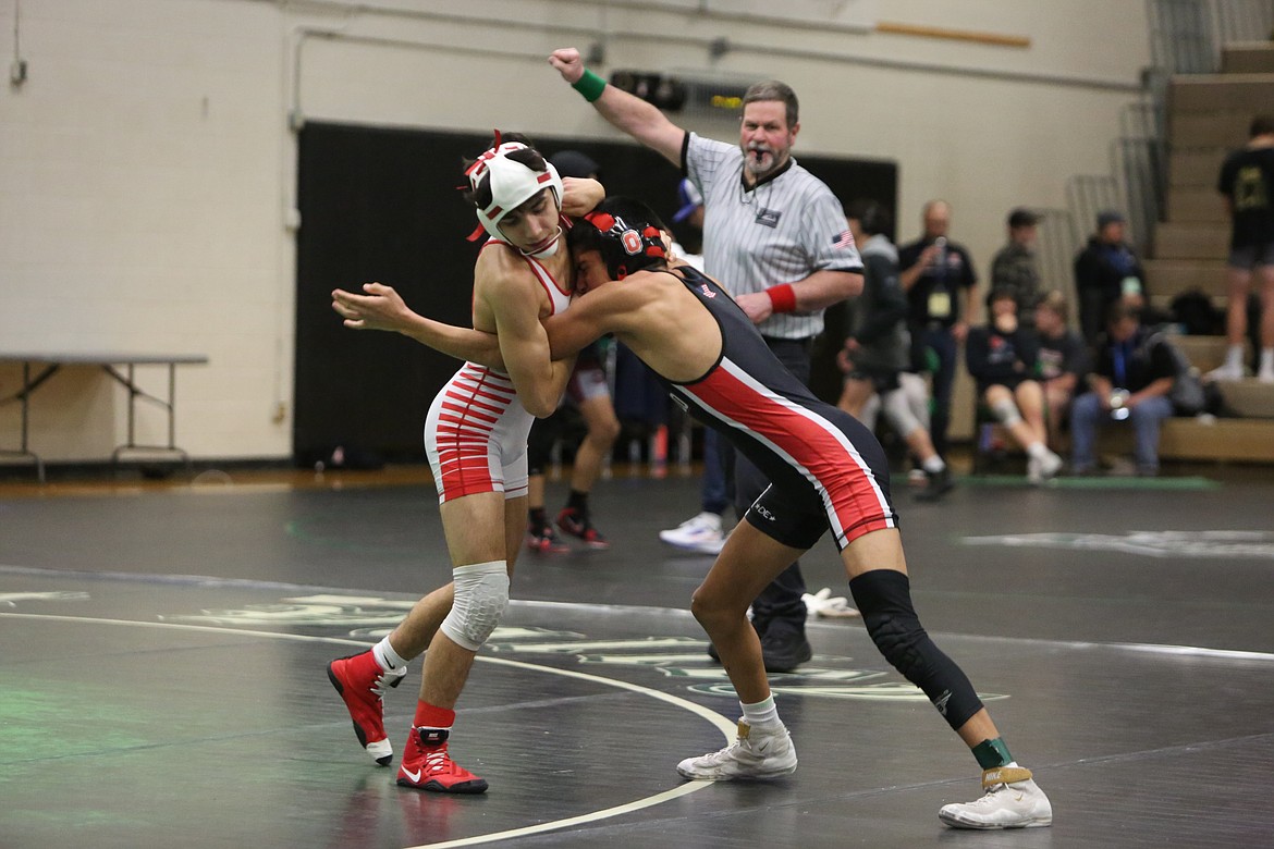 Othello’s Isaac Campos, left, and Daniel Gonzalez, right, wrestle against each other at Saturday’s 2A Region 4 tournament in Spokane on Saturday. Both Campos and Gonzalez qualified for the 2A Mat Classic in the 113-pound bracket.