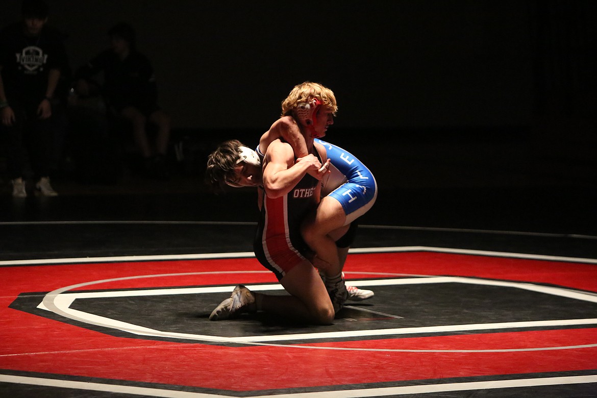 Othello senior Forrest Roylance, foreground, is one of four Huskie returnering placers to the Mat Classic. Roylance placed seventh 132-pound bracket last year.