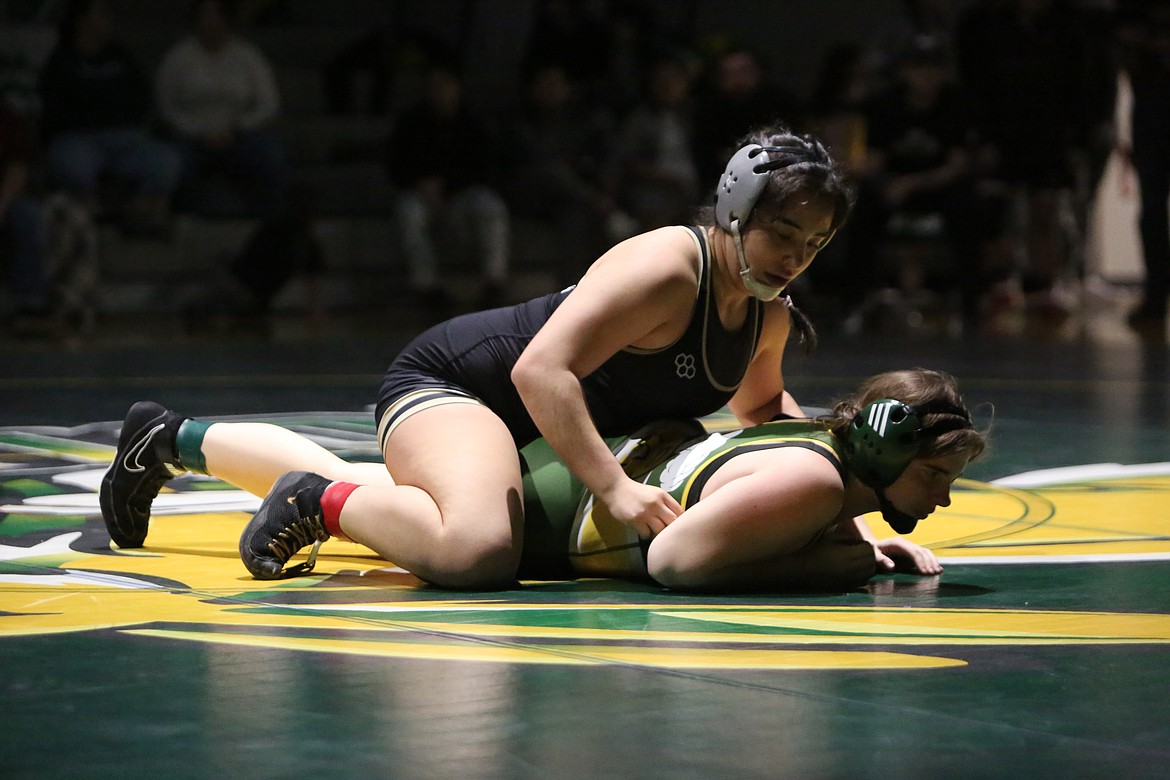 Royal junior Emma Villa, top, works against her opponent at the Quincy Bring Home Da Beef tournament. Villa is one of two Knights returning to the Mat Classic this year, having finished second at last year’s state tournament.