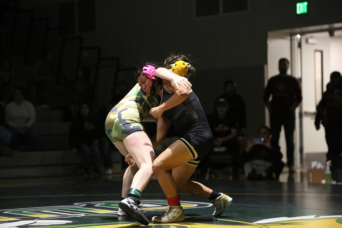 Royal senior Alondra Morales, right, returns to state after winning a state title in the 140-poud bracket at the 2022 Mat Classic.