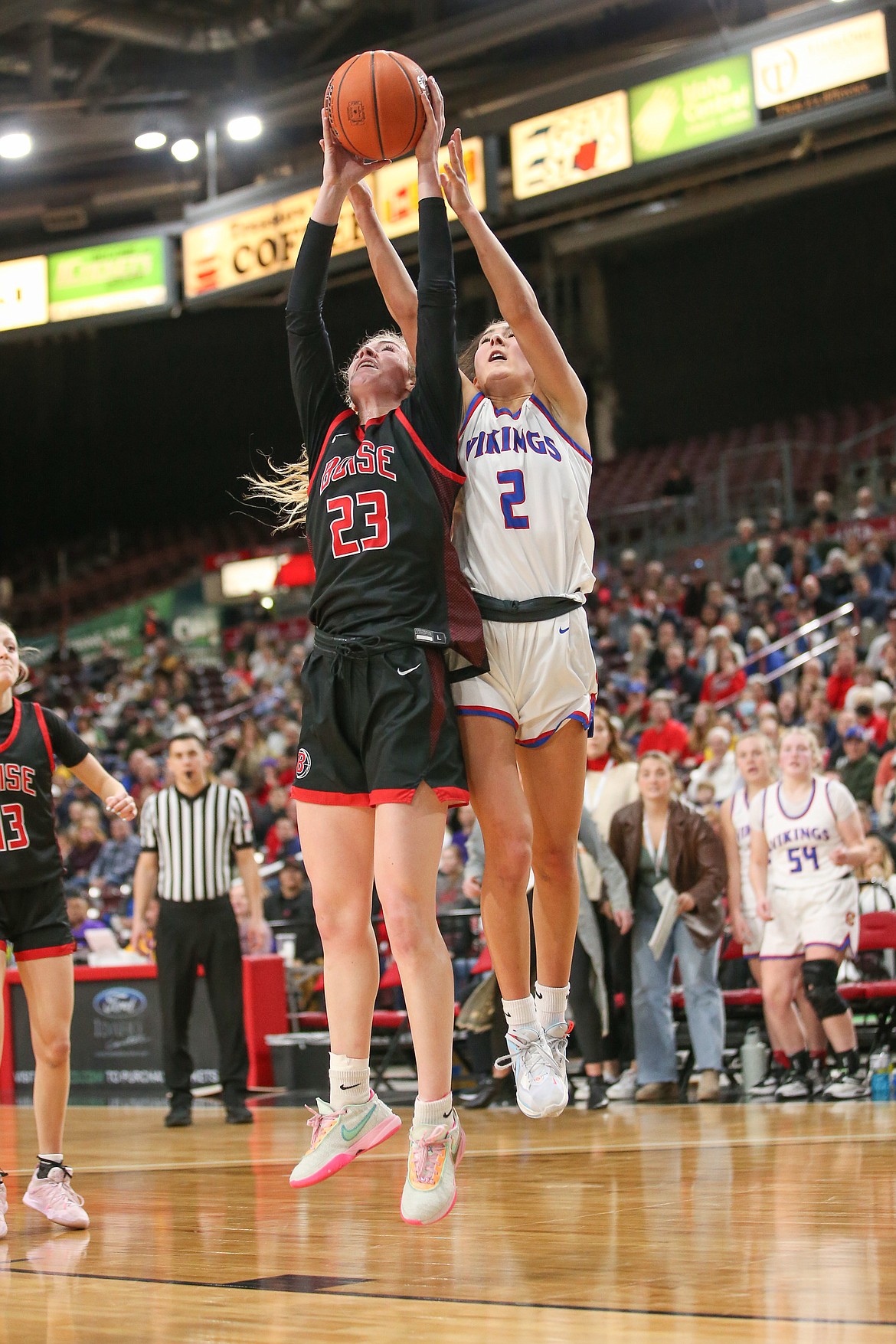 JASON DUCHOW PHOTOGRAPHY
Maddie Mitchell (2) of Coeur d'Alene and Avery Howell (23) of Boise battle for a rebound in a state 5A girls basketball semifinal Friday afternoon at the Ford Idaho Center in Nampa.