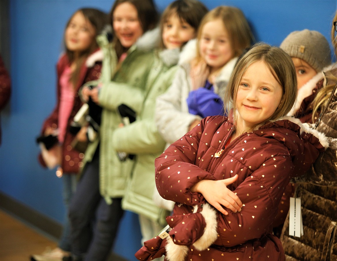 Alexandra McGraw is smiles as she wears her new coat on Thursday at the Boys and Girls Club in Coeur d'Alene.