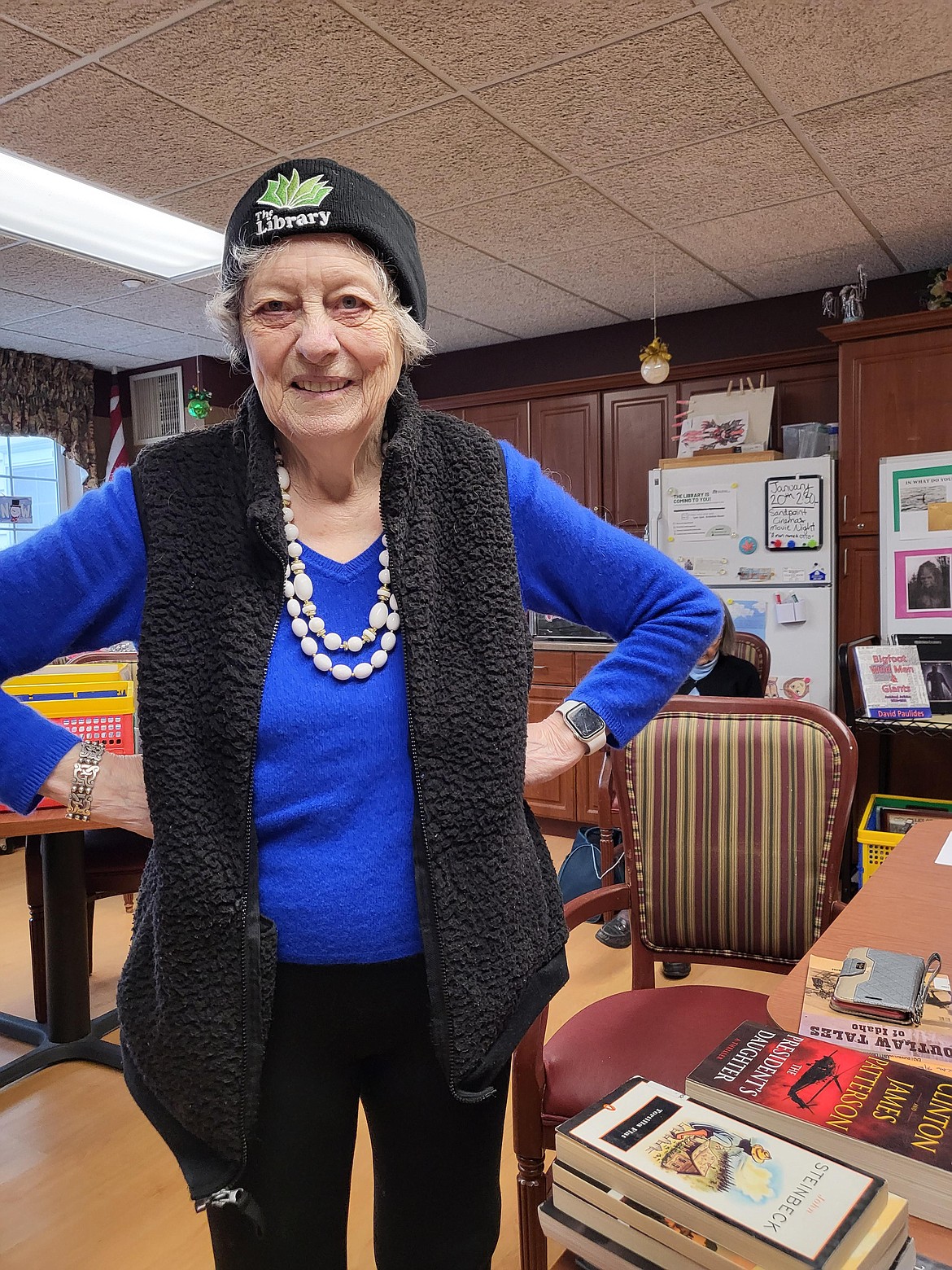 An area resident proudly shows off the hat she won as part of a trivia contest — one of the many activities incorporated into the East Bonner County Library District's outreach program.