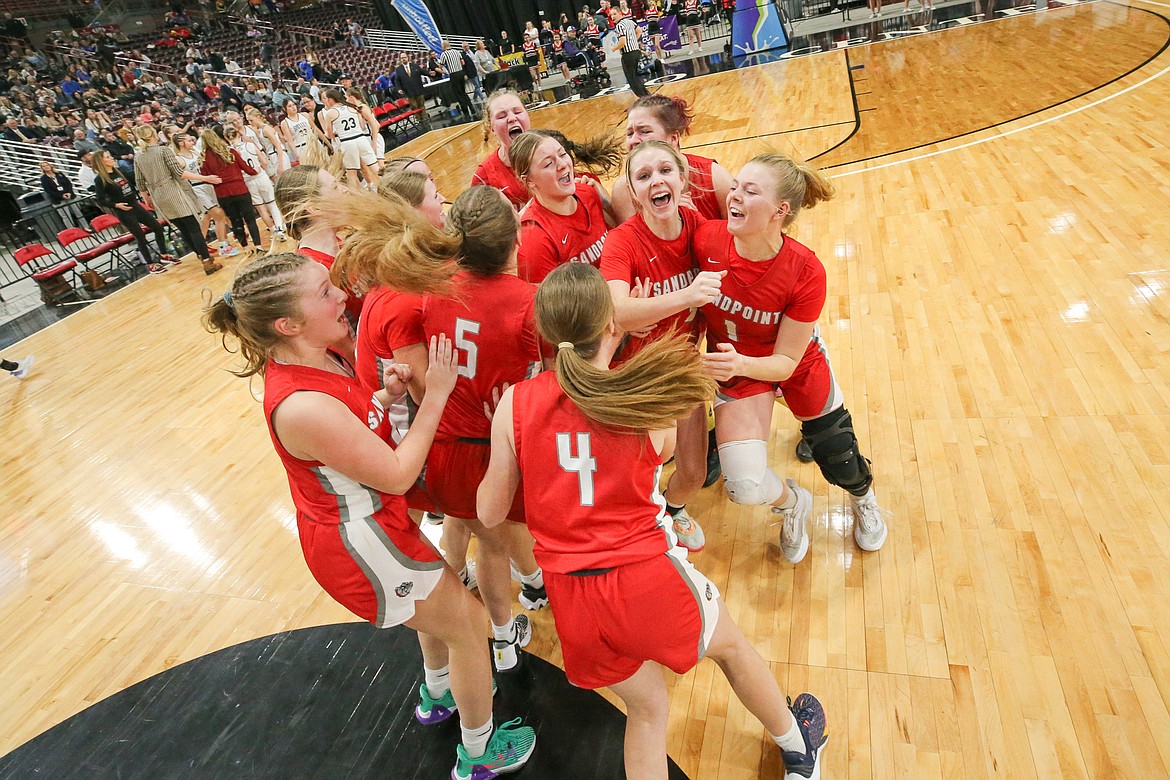 Sandpoint player celebrate after they won the girls 4A championship on Saturday. It's the first state title in the program's history.