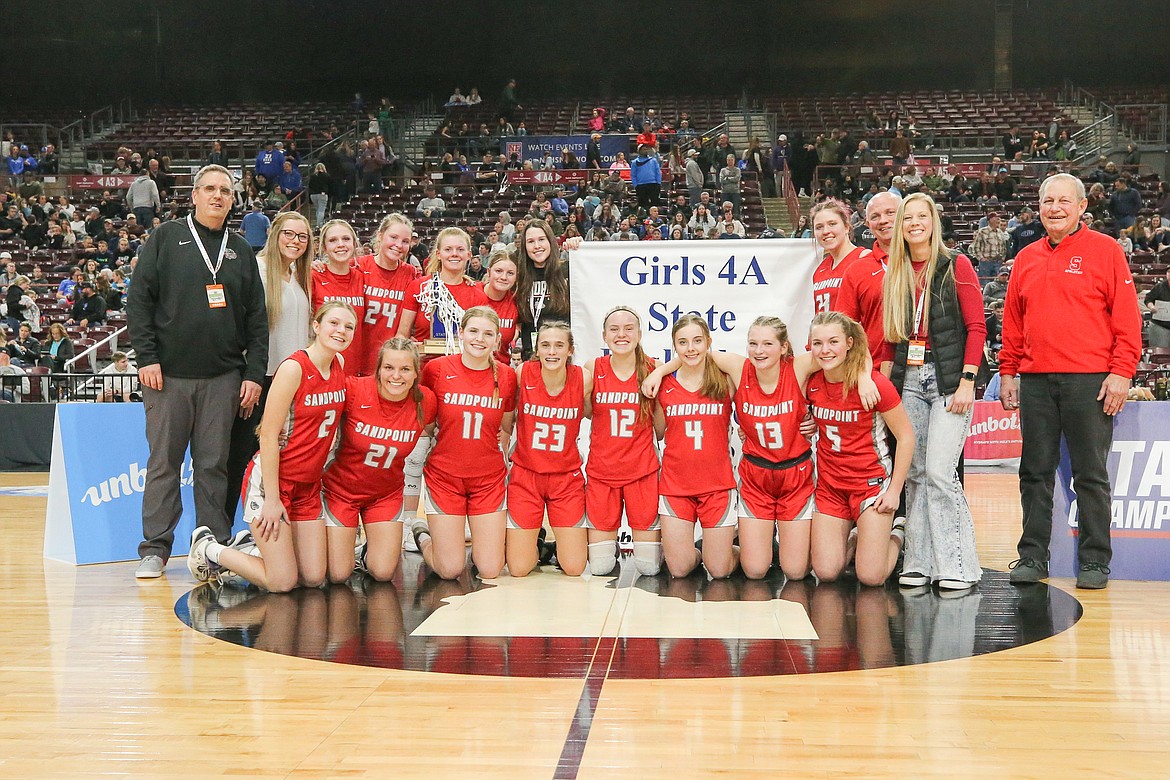 Sandpoint Bulldogs girls basketball team poses for a photo after the first state title in the program's history on Saturday.