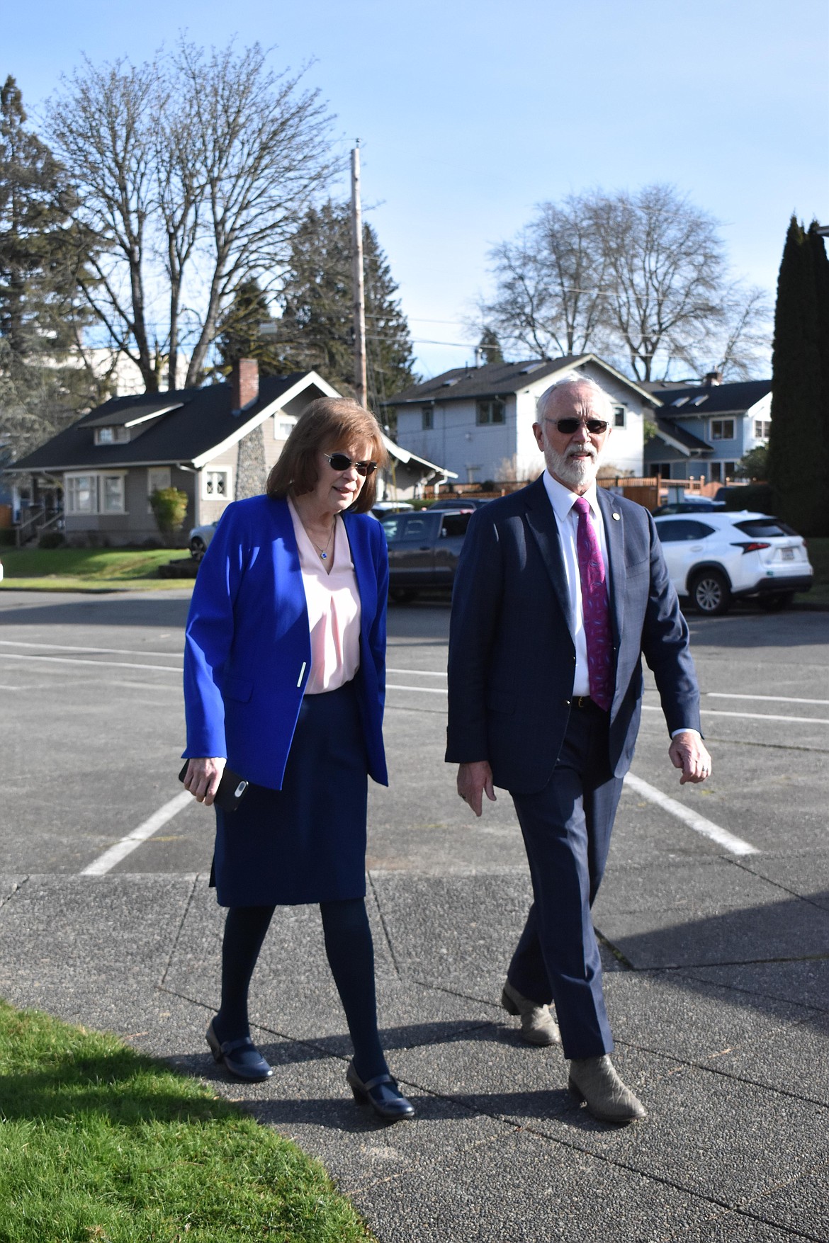 Warnick talks with Rep. Dan Newhouse, R-Yakima, after he was presented with the sign that used to hang above the entrance to the Irv Newhouse building.