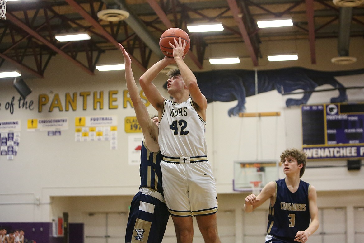 MLCA/CCS senior Michael Podolyan shoots a jump shot from the left side of the basket against Riverside Christian in the Central Washington 1B finals at Wenatchee High School.