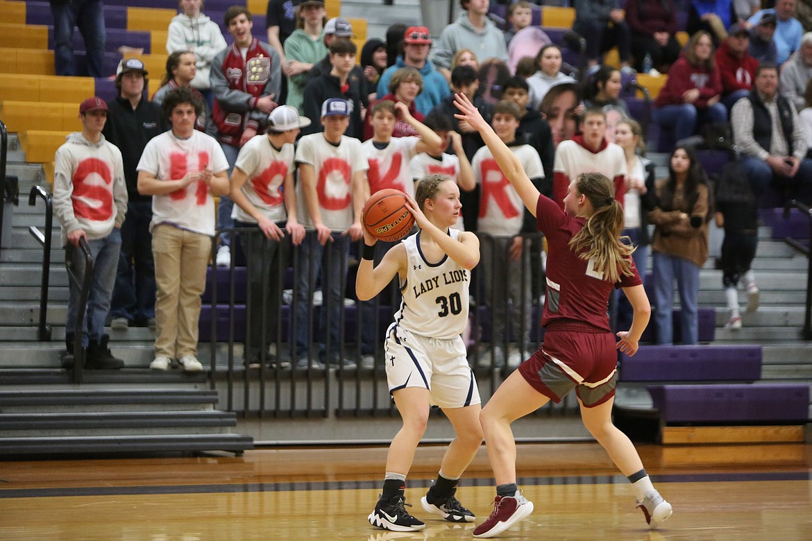 MLCA/CCS senior Ali Stanley (30) looks for an open teammate in front of the Waterville-Mansfield student section.