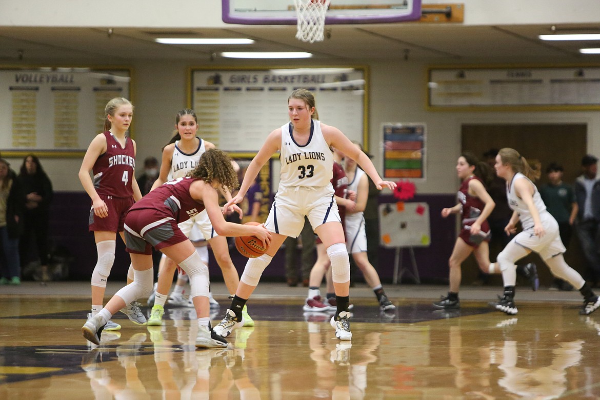 MLCA/CCS senior Kali Kast (33) defends Waterville-Mansfield freshman Holly Finkbeiner in the second half of Thursday’s Central Washington 1B district championship game in Wenatchee.