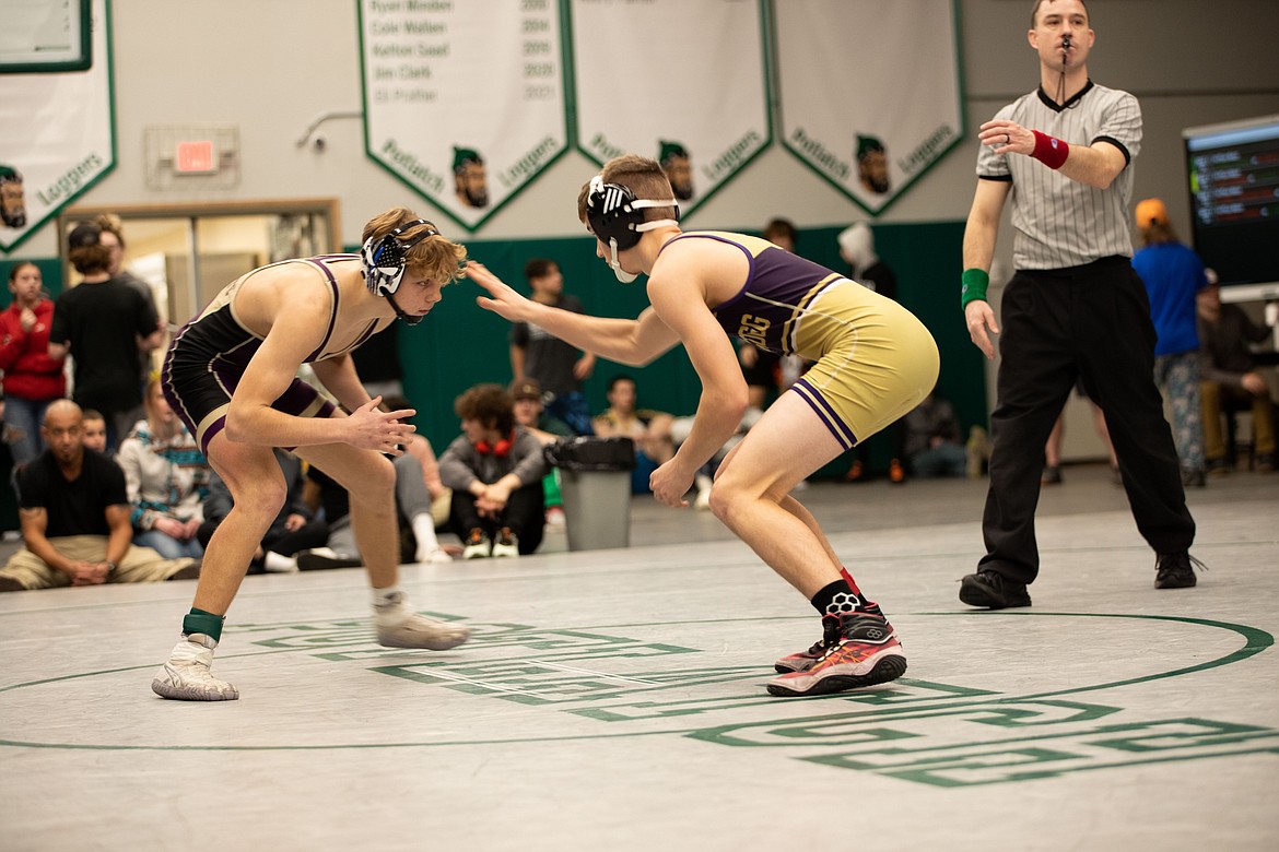 Junior Kolter Wood (left) took on teammate and sophomore Wyatt Storey for the 126-pound District Championship this past weekend. Wood would get the win, but both Wildcats will represent Kellogg at this weekend's state tournament.