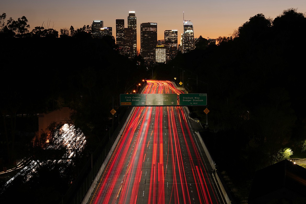 Traffic on Interstate 110 heads toward downtown Los Angeles in this long exposure photograph Friday, Jan. 27, 2023. (AP Photo/Mark J. Terrill)