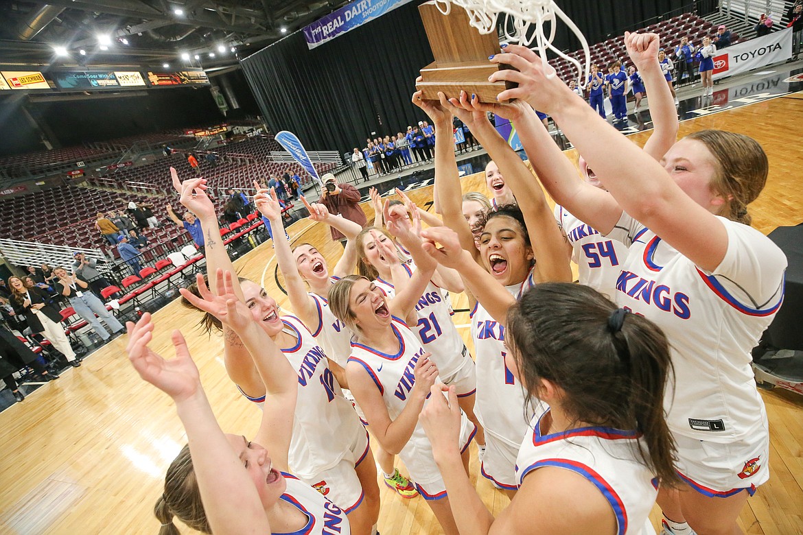 JASON DUCHOW PHOTOGRAPHY
The Coeur d'Alene High girls basketball team celebrates after routing Rocky Mountain of Meridian 65-27 in the state 5A championship game Saturday night at the Idaho Center in Nampa.